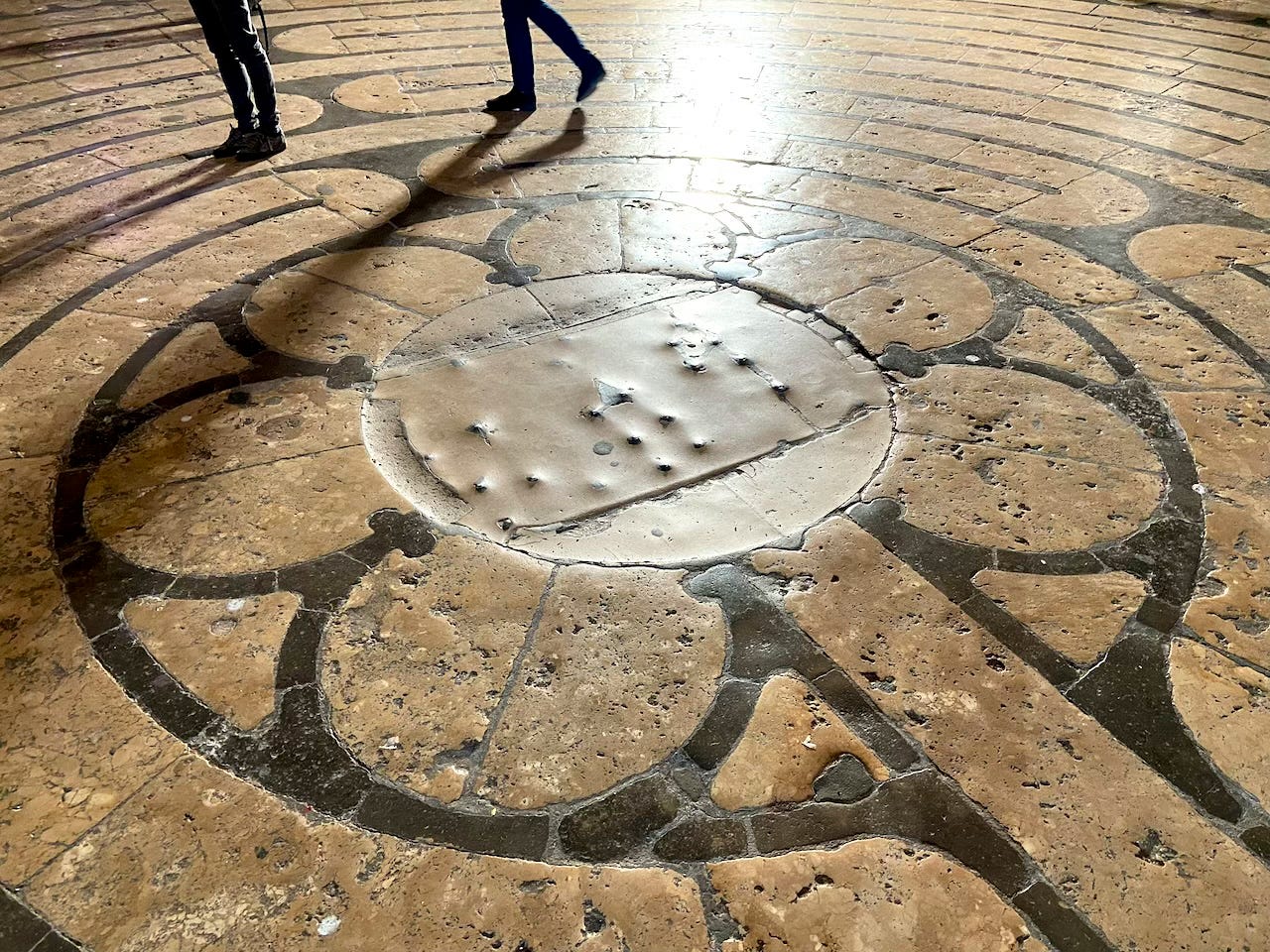 The six-petal rosette at the center of the labyrinth